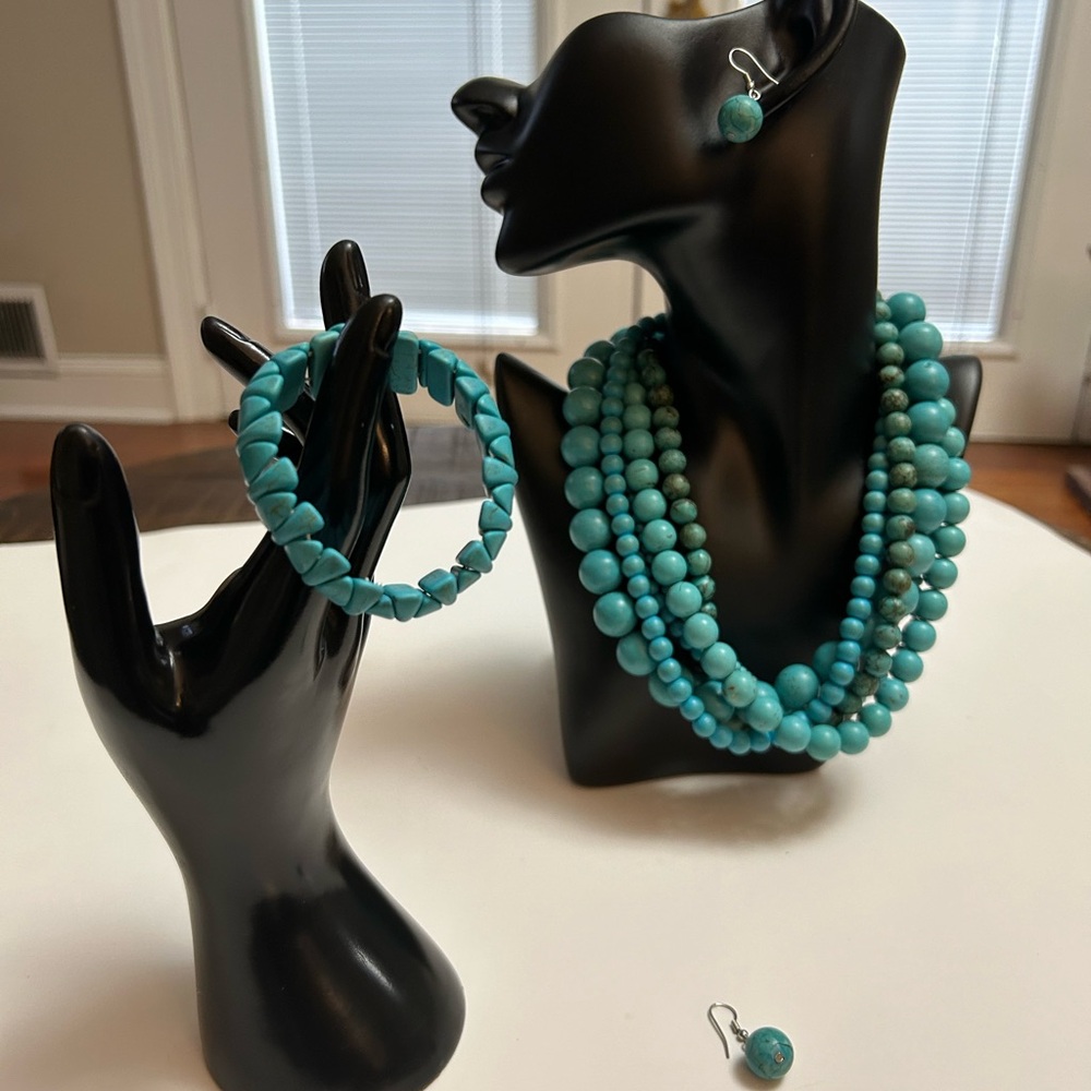 Turquoise look multilayered necklace, bracelet, and earrings set.
